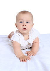 Adorable baby girl in cute clothes on blanket