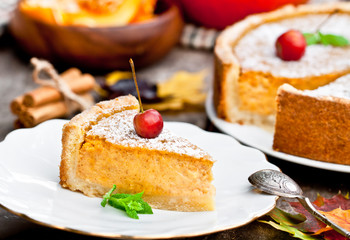 Delicious pumpkin pie  with cinnamon decorated with wild apples