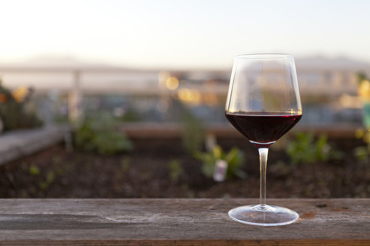 Red wine glass by the ledge