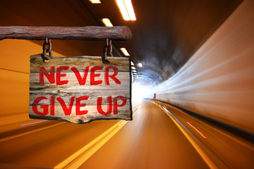 Never give up motivational phrase sign