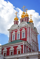 Fototapeta na wymiar Tower of the Novodevichy Convent in Moscow on a background of blue sky