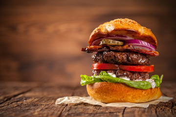 Delicious hamburger on wood