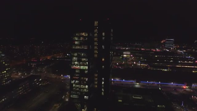 AERIAL: Downtown city district at night