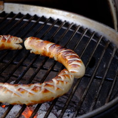 bratwurst on charcoal grill