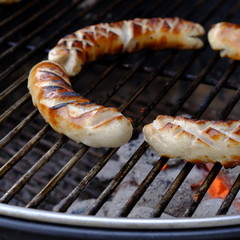 bratwurst on charcoal grill