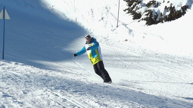 Snowboarder making snow spray