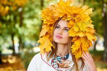 girl portrait with yellow leaves on head