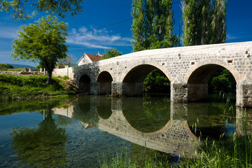 Fototapeta na wymiar Stone bridge on River Zrmanja, Croatia