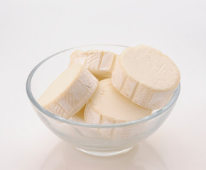 Lots of goat cheese in transparent bowl