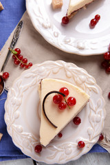 Tasty cheesecake with berries on table close up