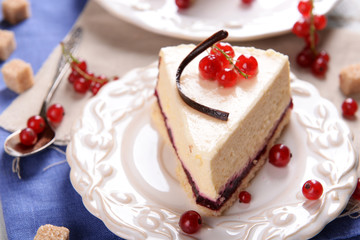 Tasty cheesecake with berries on table close up