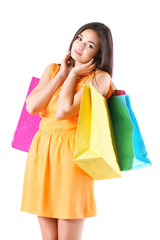 Fototapeta na wymiar Beautiful young woman with shopping bags isolated on white