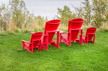 Fototapeta premium Adirondack Chairs Facing the Ocean