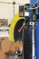 Car on lift in a repair workshop