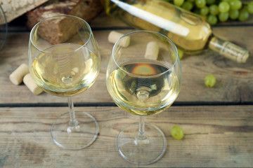 Still life of wine and bread on rustic wooden background