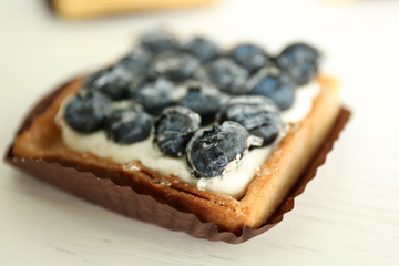 Gourmet fresh blueberry tart on table