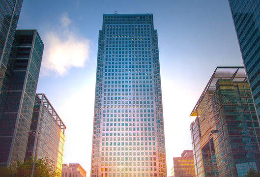  LONDON, UK - May 18, 2015: Banking headqquaters in Canary Wharf. Office building at sunset