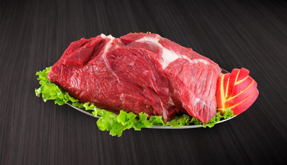 Decorated fresh raw meat - ham with vegetables with clipping pat