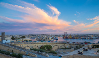 Sunset over Malta with cannons of Valletta - Malta