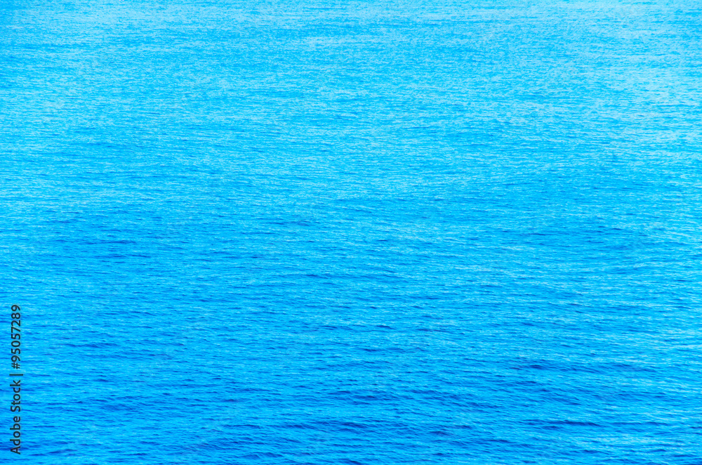 Wall mural Blue sea water background