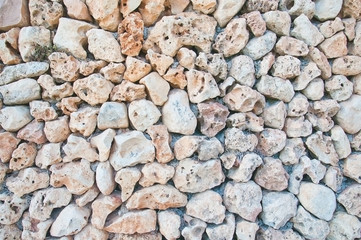 Drystone wall background texture on a sunny summer day in Mallorca, Balearic islands, Spain.