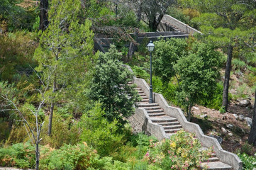 Staircase in zigzag pattern in a rural forest on a sunny summer day in Mallorca, Balearic islands,...