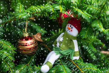 Christmas Tree and A Snowman in the Red Hat and Green Scarf