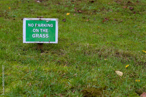 "No Parking On the Grass Sign Over Green Lawn" Stock photo and royalty