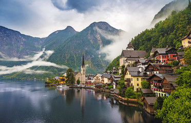 Scenic picture-postcard view of famous Hallstatt mountain village with Hallstaetter Lake in the Austrian Alps, region of Salzkammergut, Austria