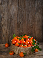 Fototapeta na wymiar Large basket of tangerines