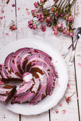 Chocolate cupcake with icing, herbarium of dried roses.selective focus