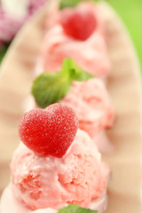 Watermelon ice cream in bowl  on color wooden background