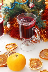 mulled wine with decorated christmas tree
