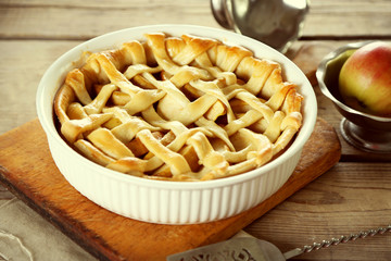 Homemade apple pie on wooden background