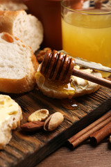 Healthy breakfast with bread, honey, nuts. Country breakfast concept