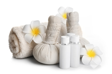 Obraz na płótnie Canvas Spa set with massage balls, towel, aroma oil and frangipani flower isolated on white