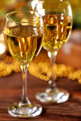 Champagne and Christmas decoration on bright background