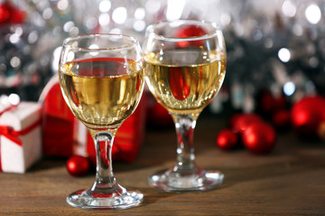 Champagne and Christmas decoration on bright background