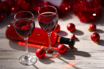 Wine and Christmas decoration on wooden table