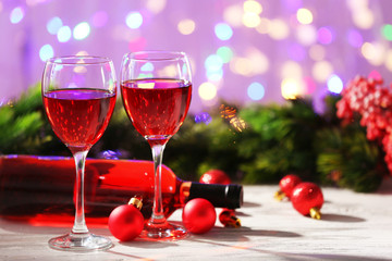 Wine and Christmas decoration on bright background