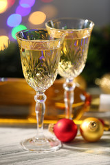 Champagne and Christmas decoration on wooden table