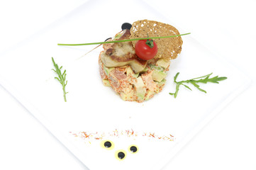 salad, fish and eggs decorated with greens and tomatoes