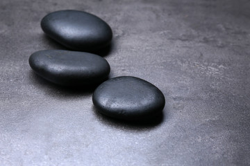 Fototapeta na wymiar Group of pebbles on dark background