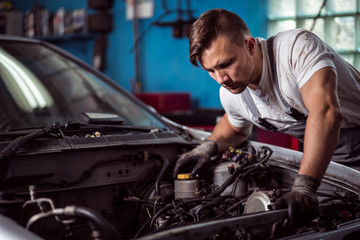 Fototapeta na wymiar Car inspection at mechanic shop