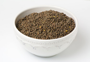 Bowl raw lentils, food background