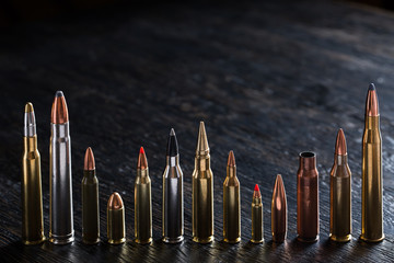 Number of large-caliber ammunition with different caliber - obrazy, fototapety, plakaty