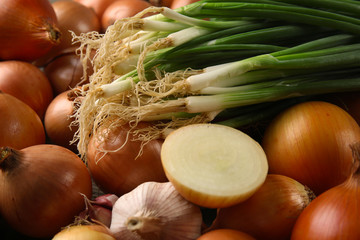 Fresh different onions and garlic background