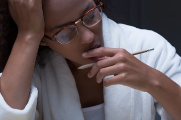Tired girl yawning while learning