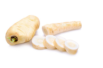 Fresh parsnip roots on a white background
