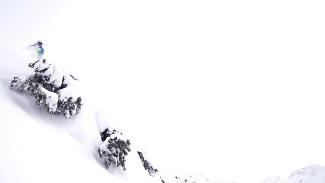 SLOW MOTION: snowboarder jumping